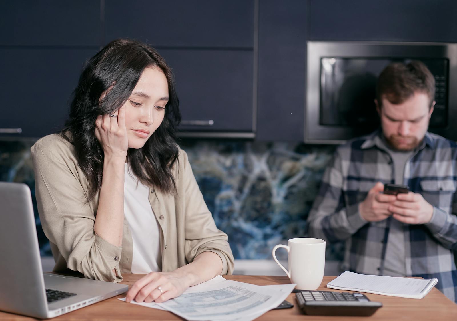 A business owner reviewing overdue accounts at a desk