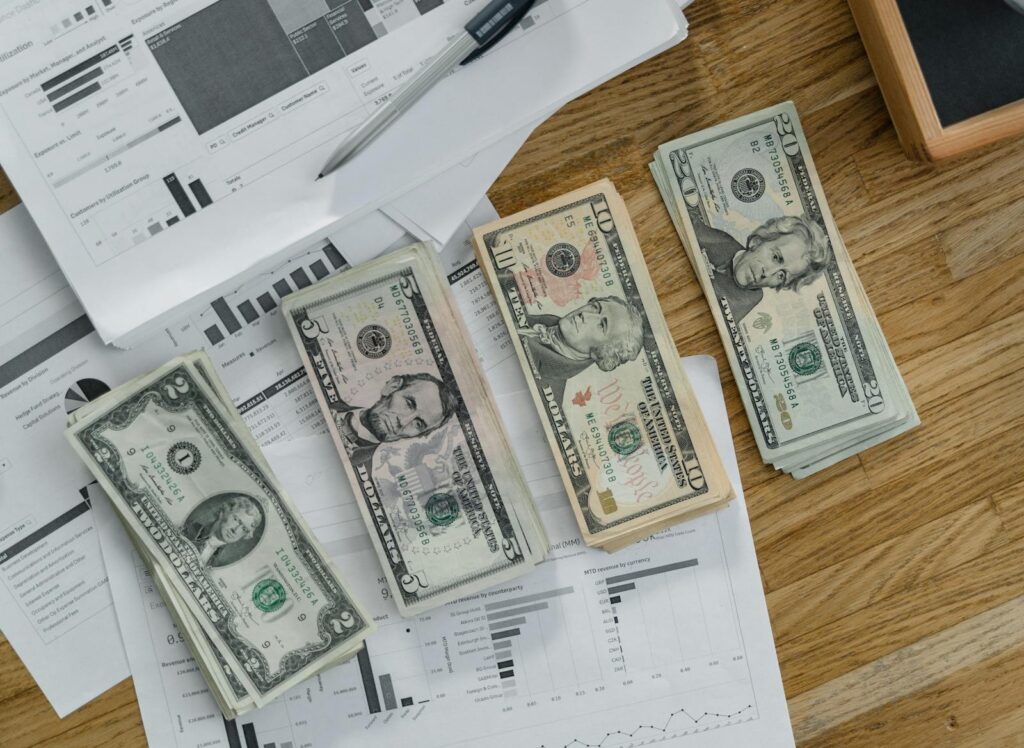 Printed financial charts and reports on a desk