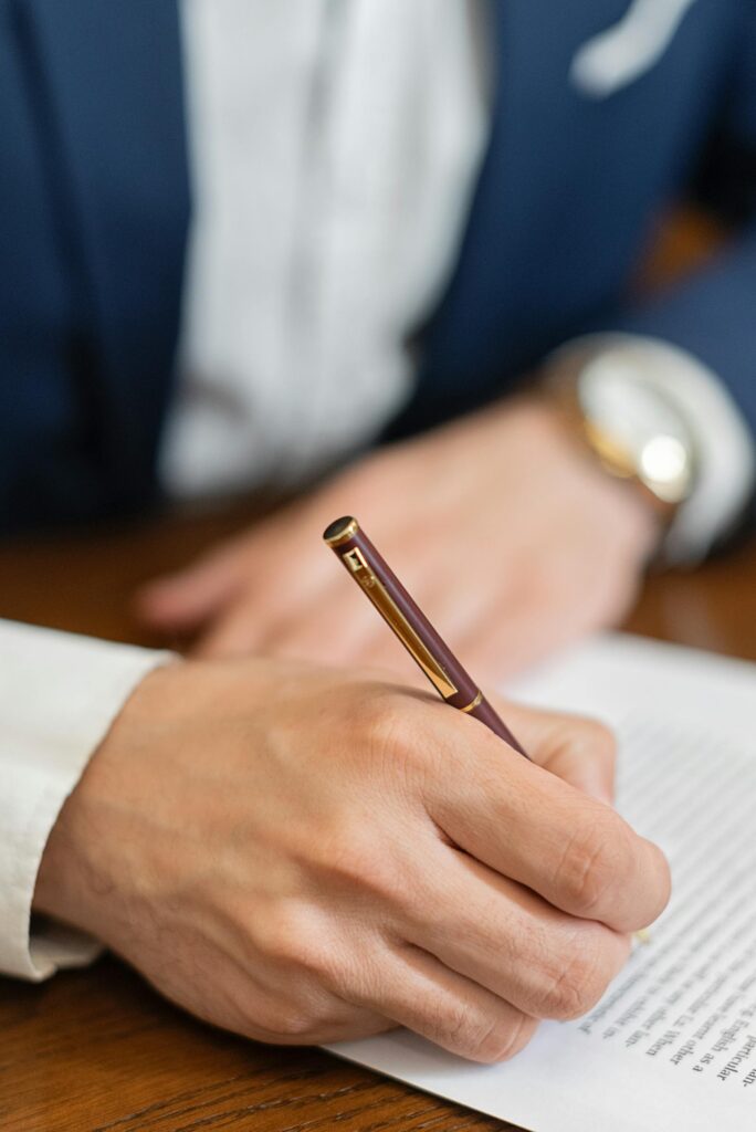 Signing a formal document with a pen