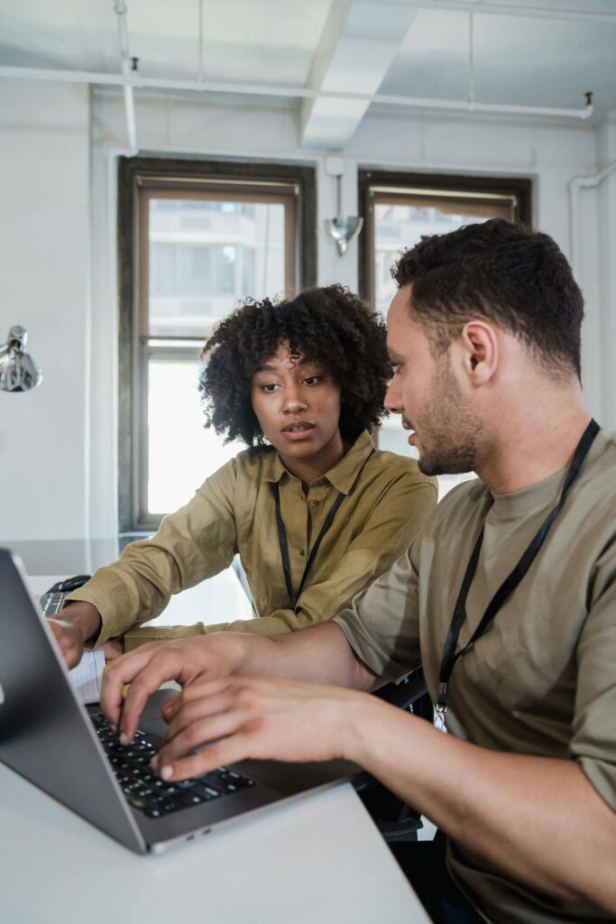 A small business team working together at a laptop